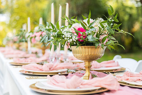 Close up of fancy rose floral centerpiece for outdoor dining